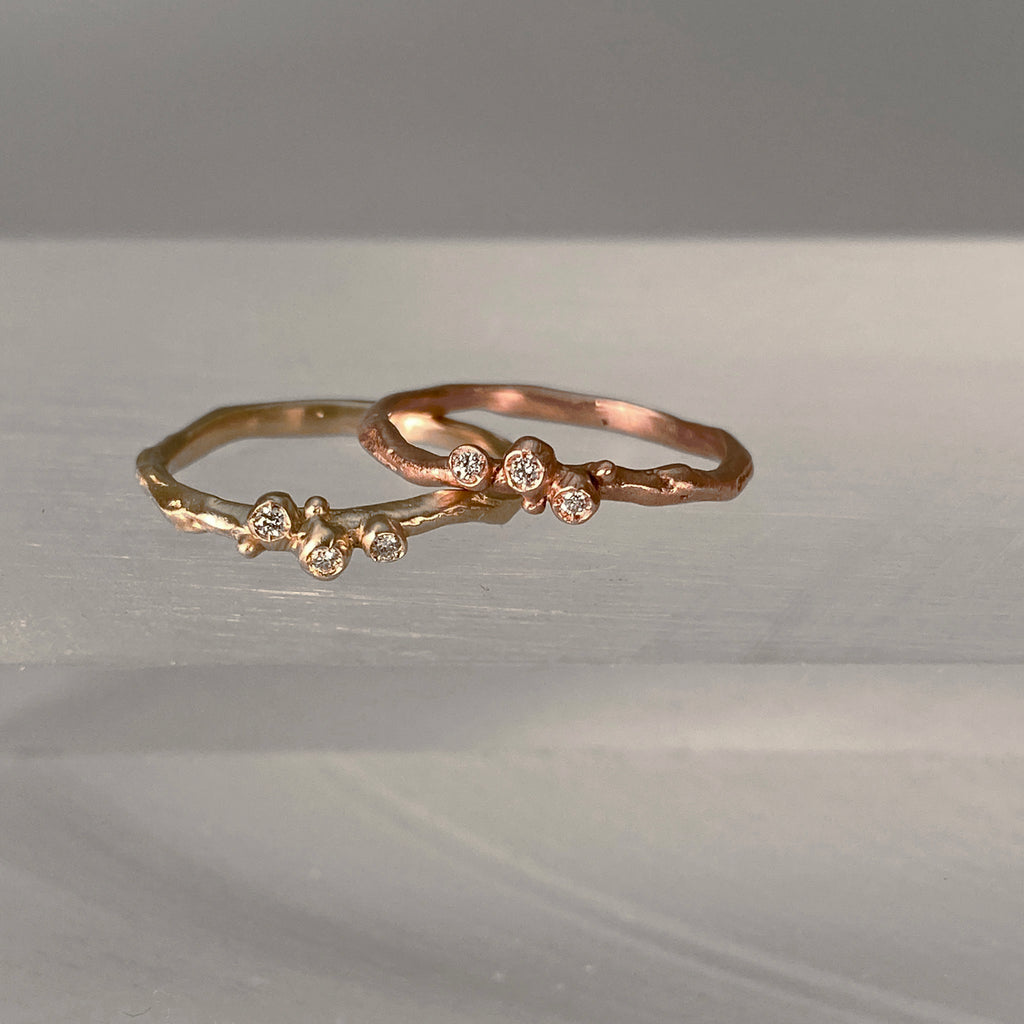 Small, single branch ring with 3 diamond buds; shown in yellow and rose gold